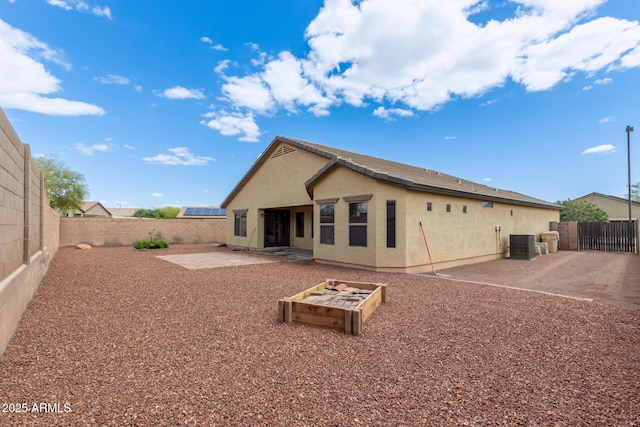 25212 W Maldonado Dr, Buckeye, AZ 85326 - back of property with a patio, a fenced backyard, and stucco siding