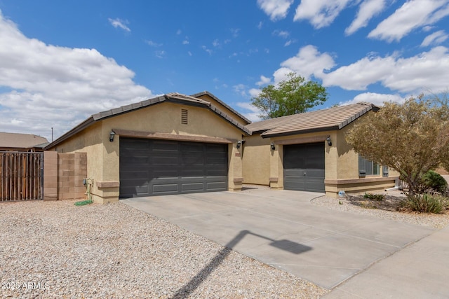 25212 W Maldonado Dr, Buckeye, AZ 85326 - ranch-style house with stucco siding, fence, concrete driveway, and a garage