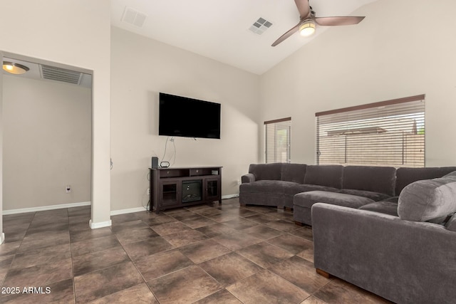 25212 W Maldonado Dr, Buckeye, AZ 85326 - living area featuring a ceiling fan, high vaulted ceiling, visible vents, and baseboards