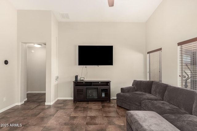 25212 W Maldonado Dr, Buckeye, AZ 85326 - living area with visible vents, a ceiling fan, and baseboards
