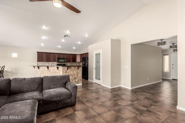 25212 W Maldonado Dr, Buckeye, AZ 85326 - living room with high vaulted ceiling, ceiling fan, baseboards, and visible vents