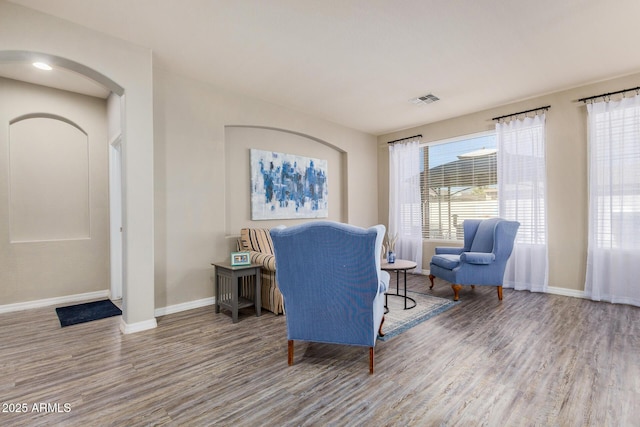 living area with hardwood / wood-style flooring