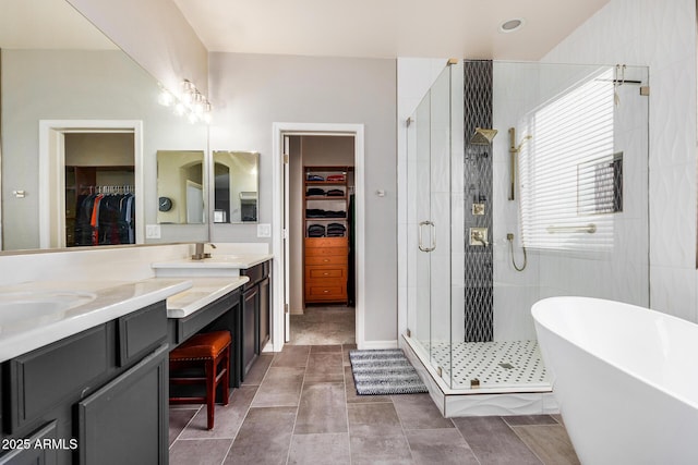 bathroom featuring vanity and separate shower and tub