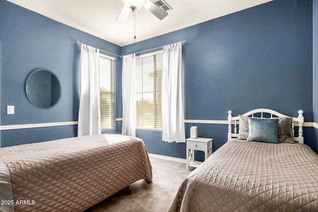 bedroom with ceiling fan and carpet flooring