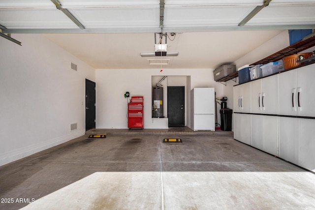 garage with white refrigerator, a garage door opener, and water heater