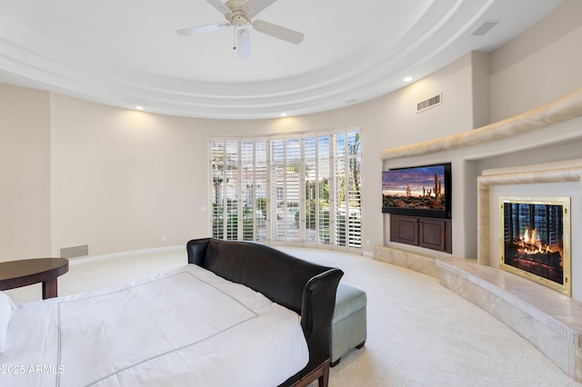 bedroom featuring carpet floors, recessed lighting, a high end fireplace, a ceiling fan, and baseboards