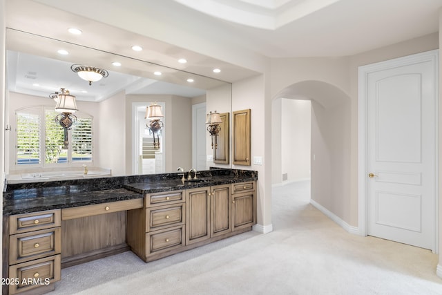 full bathroom with recessed lighting, vanity, baseboards, carpet, and a tub