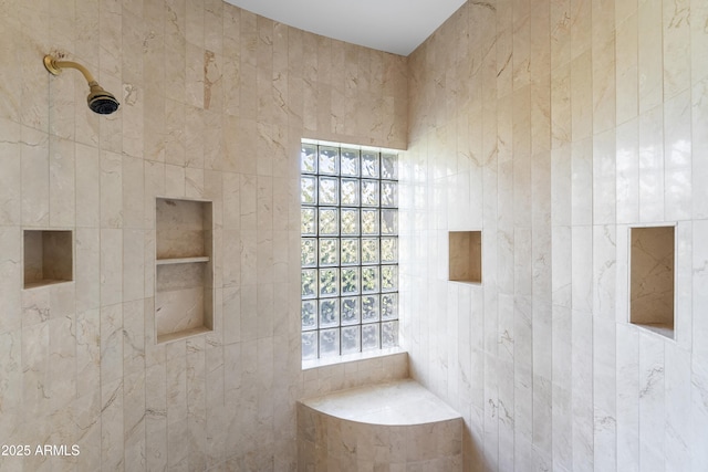 full bathroom with a tile shower
