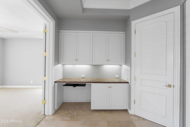 unfurnished office featuring baseboards