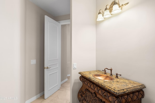 bathroom featuring a sink and baseboards
