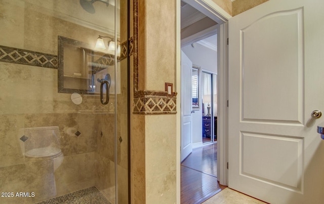 6900 E Princess Dr Unit 1176, Phoenix, AZ 85054 - bathroom with ornamental molding, a stall shower, and wood finished floors