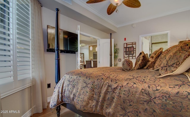 6900 E Princess Dr Unit 1176, Phoenix, AZ 85054 - bedroom featuring ornamental molding, wood finished floors, baseboards, and a ceiling fan