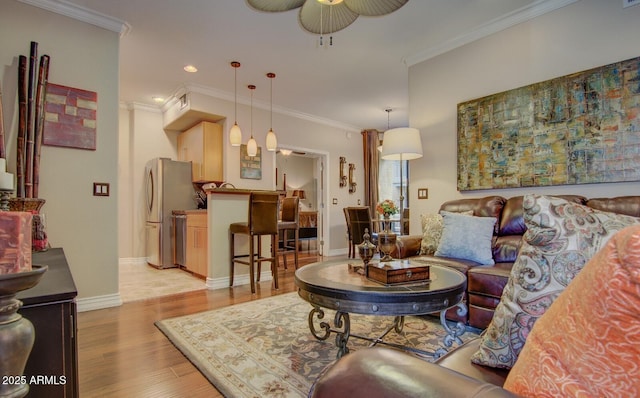 6900 E Princess Dr Unit 1176, Phoenix, AZ 85054 - living room with a ceiling fan, light wood finished floors, crown molding, baseboards, and recessed lighting