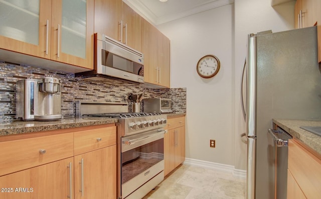 6900 E Princess Dr Unit 1176, Phoenix, AZ 85054 - kitchen with appliances with stainless steel finishes, decorative backsplash, baseboards, ornamental molding, and light stone countertops
