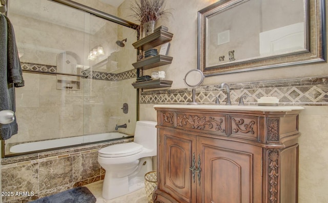 6900 E Princess Dr Unit 1176, Phoenix, AZ 85054 - full bath with toilet, tiled shower / bath, vanity, tile walls, and tile patterned flooring