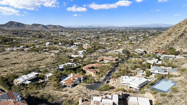 birds eye view of property with a mountain view