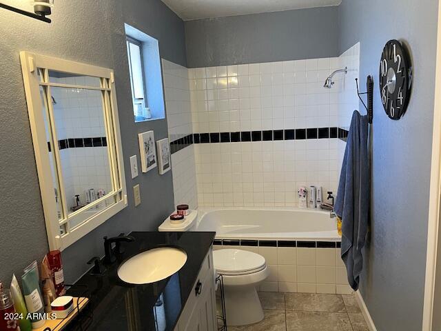 full bathroom with tile patterned flooring, vanity, independent shower and bath, and toilet