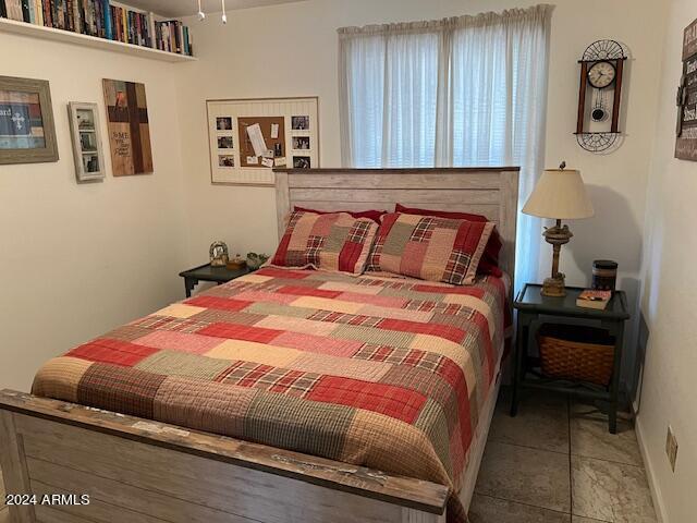 bedroom with tile patterned floors