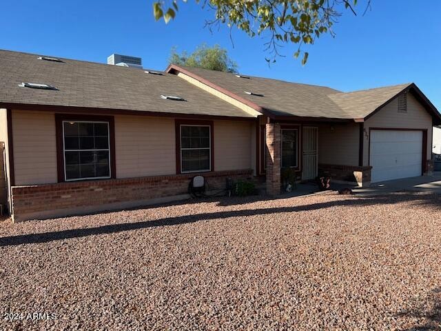 ranch-style home with a garage