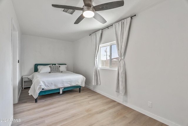 bedroom featuring ceiling fan and light hardwood / wood-style floors