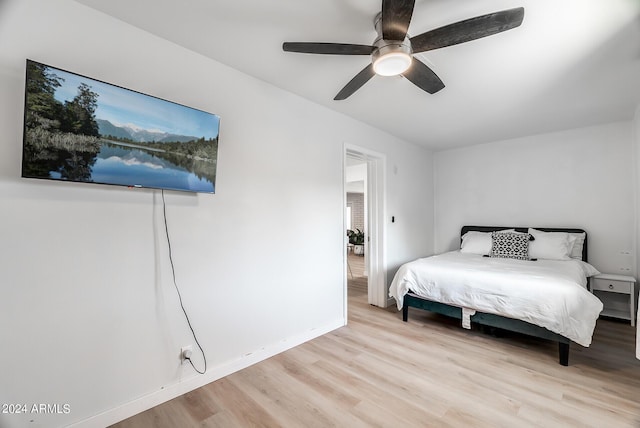 bedroom featuring light wood-type flooring and ceiling fan