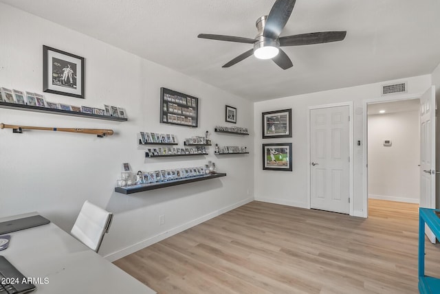 interior space with ceiling fan and light wood-type flooring