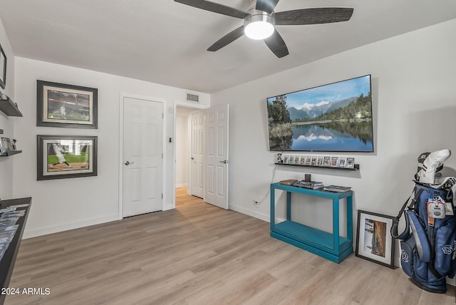 interior space with ceiling fan and light wood-type flooring