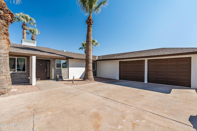 ranch-style home featuring a garage