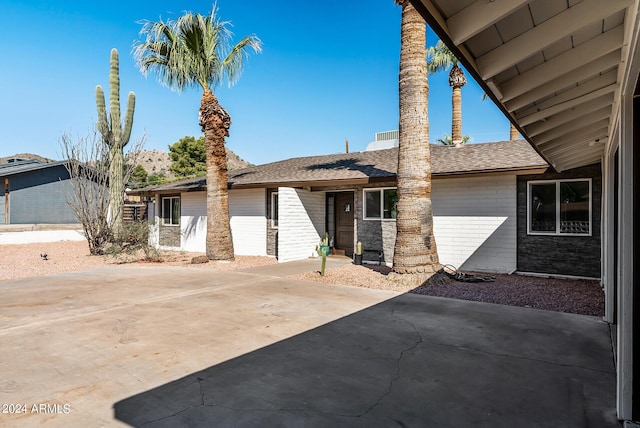 view of front of house with a patio area