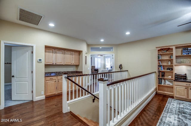 corridor featuring dark hardwood / wood-style floors