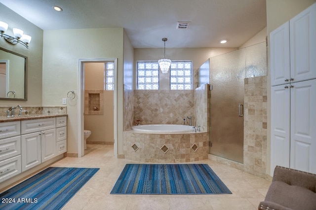 full bathroom featuring vanity, toilet, separate shower and tub, and tile patterned flooring