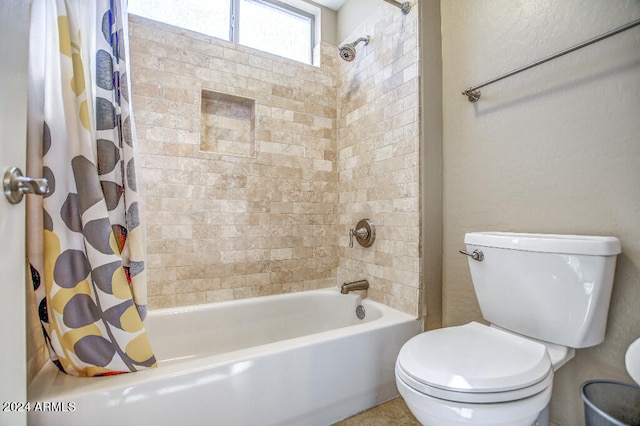 bathroom with toilet and shower / bath combo