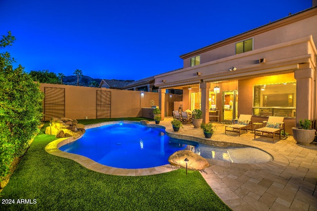 view of pool with a patio, a yard, and an outdoor hangout area