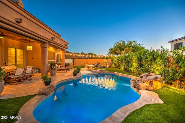 view of pool featuring a patio area and a lawn