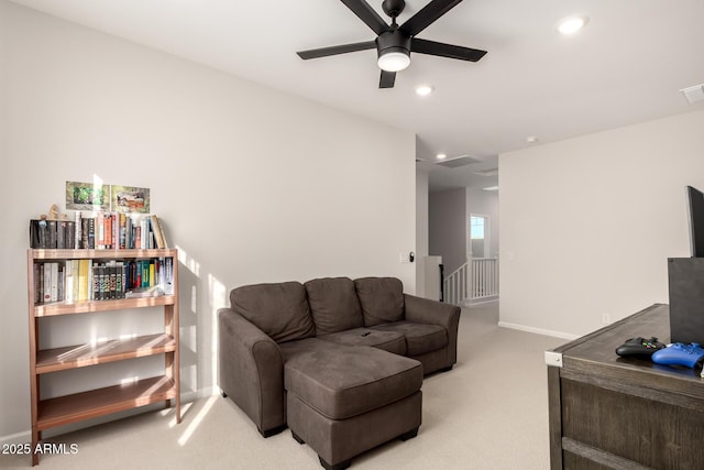 living area featuring recessed lighting, light colored carpet, visible vents, a ceiling fan, and baseboards