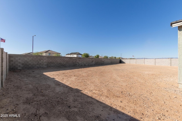 view of yard with a fenced backyard