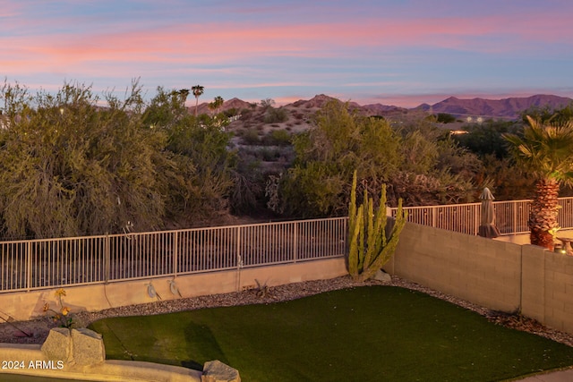 yard at dusk with a mountain view