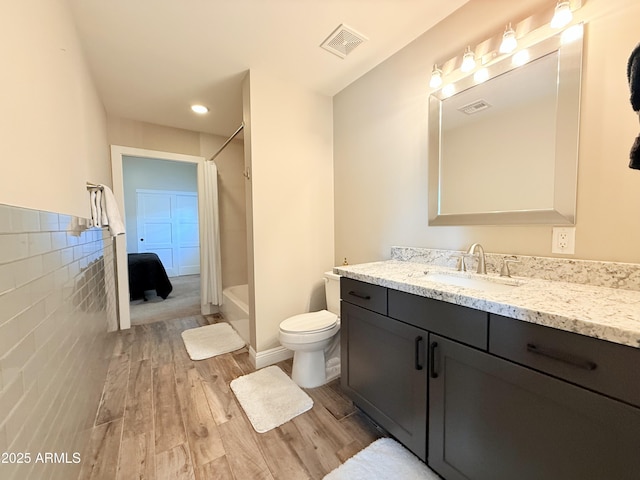 218 N Palm St, Gilbert, AZ 85234 - full bathroom featuring wood finished floors, vanity, and toilet