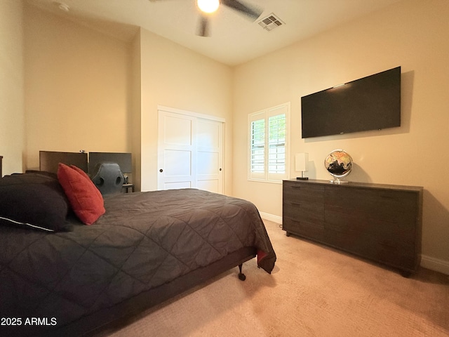 218 N Palm St, Gilbert, AZ 85234 - bedroom featuring light colored carpet, baseboards, a ceiling fan, and a closet