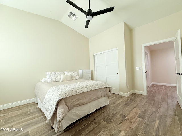 218 N Palm St, Gilbert, AZ 85234 - bedroom with a closet, wood finished floors, vaulted ceiling, baseboards, and a ceiling fan