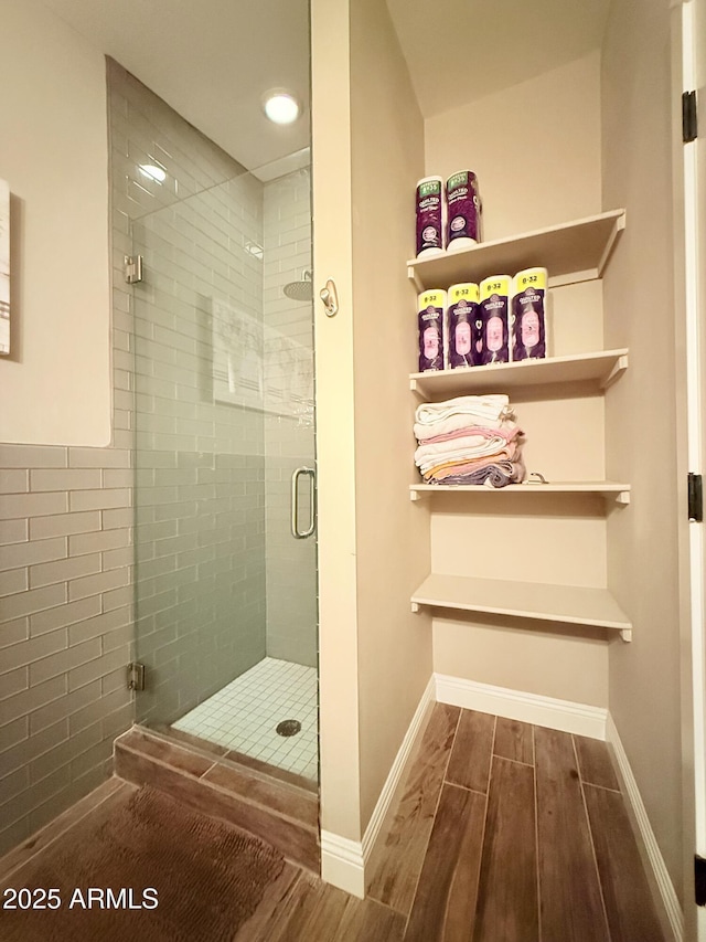 218 N Palm St, Gilbert, AZ 85234 - bathroom with wood finished floors, a shower stall, and baseboards