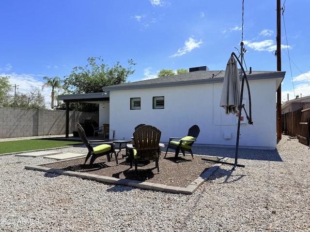 218 N Palm St, Gilbert, AZ 85234 - rear view of house featuring a fenced backyard, a patio area, and stucco siding