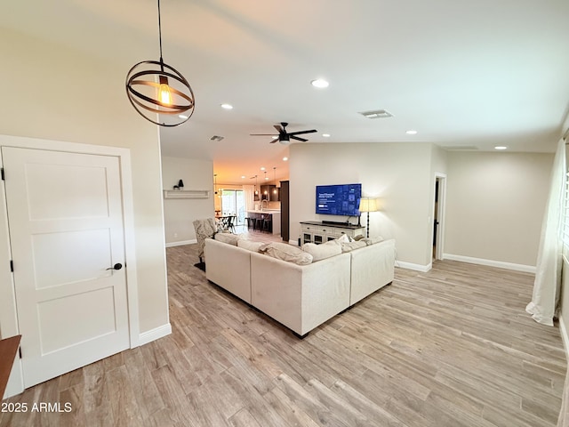 218 N Palm St, Gilbert, AZ 85234 - living area featuring baseboards, recessed lighting, ceiling fan, and light wood-style flooring