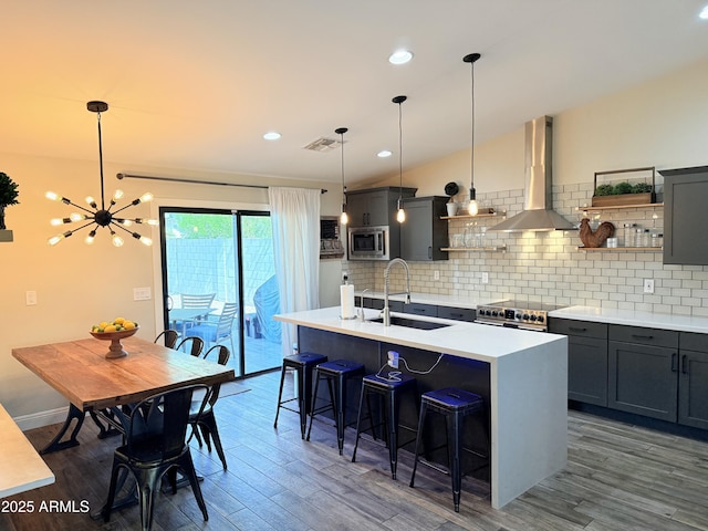218 N Palm St, Gilbert, AZ 85234 - kitchen with island range hood, stainless steel appliances, open shelves, a sink, and recessed lighting