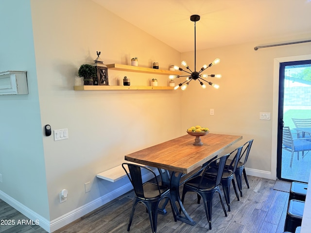 218 N Palm St, Gilbert, AZ 85234 - dining space featuring wood finished floors, baseboards, a chandelier, and vaulted ceiling