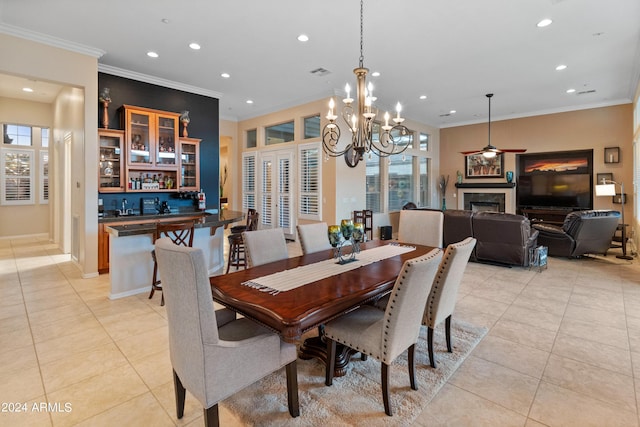 tiled dining room featuring crown molding and ceiling fan