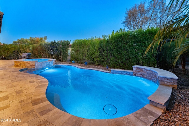 view of pool with pool water feature, an in ground hot tub, and a patio area