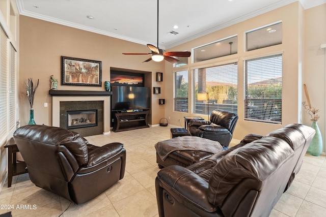 tiled living room with crown molding and ceiling fan