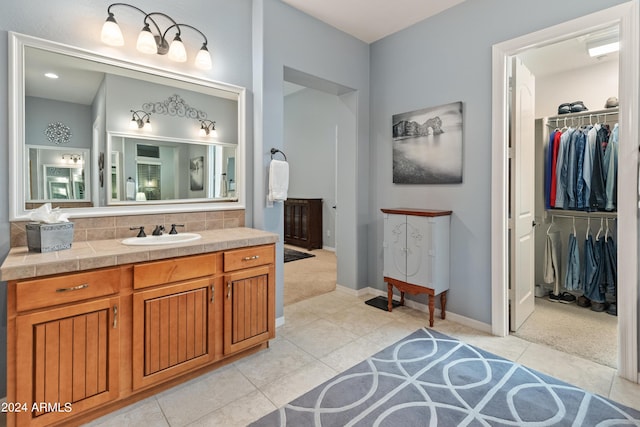 bathroom with vanity and tile patterned floors