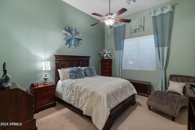 carpeted bedroom with vaulted ceiling and ceiling fan